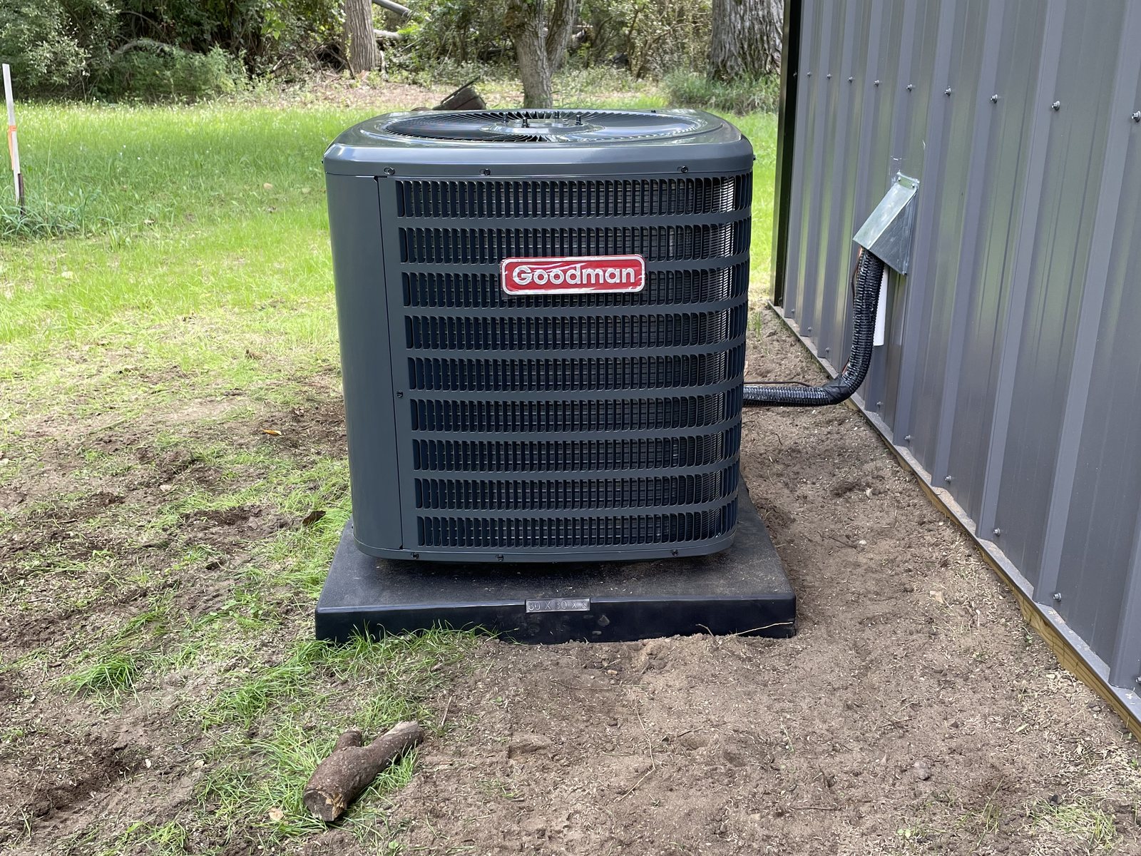 New condenser on a level pad, clean line set