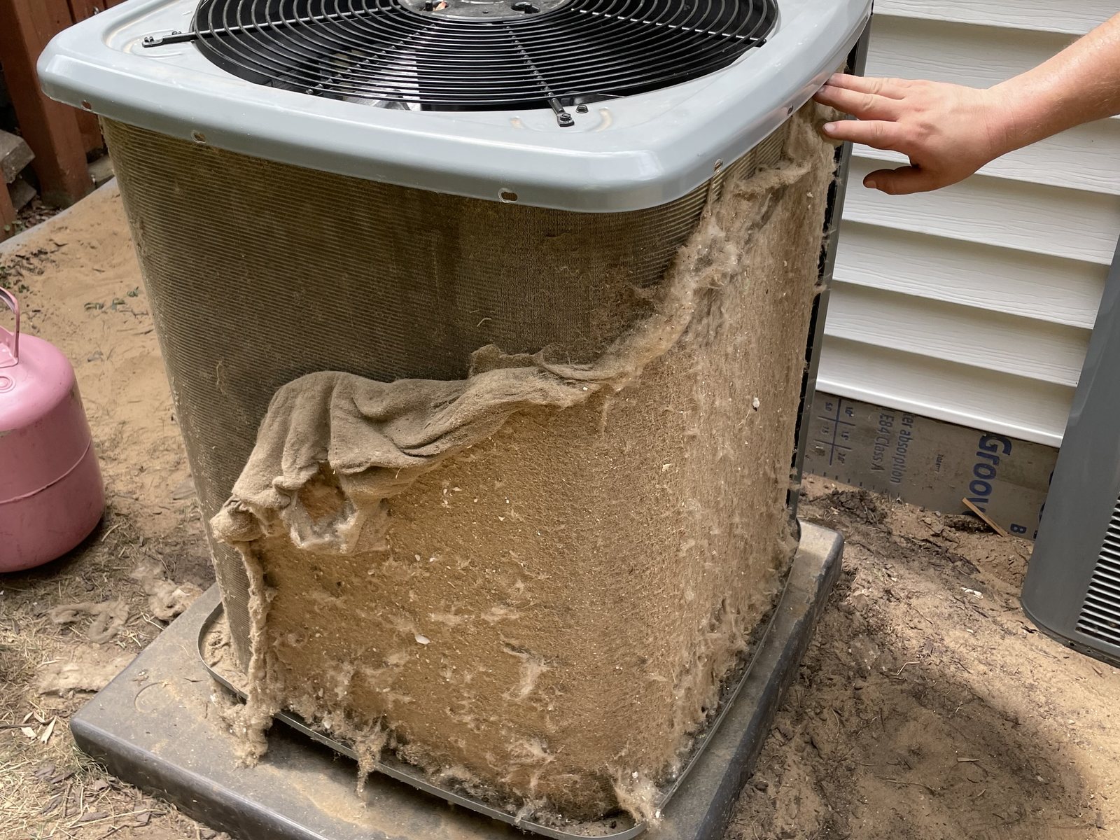 Condenser packed with cottonwood before a cleaning