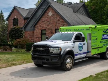 Amistee duct cleaning truck in a driveway
