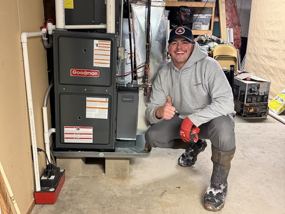 A finished install: new furnace, clean venting, swept floor