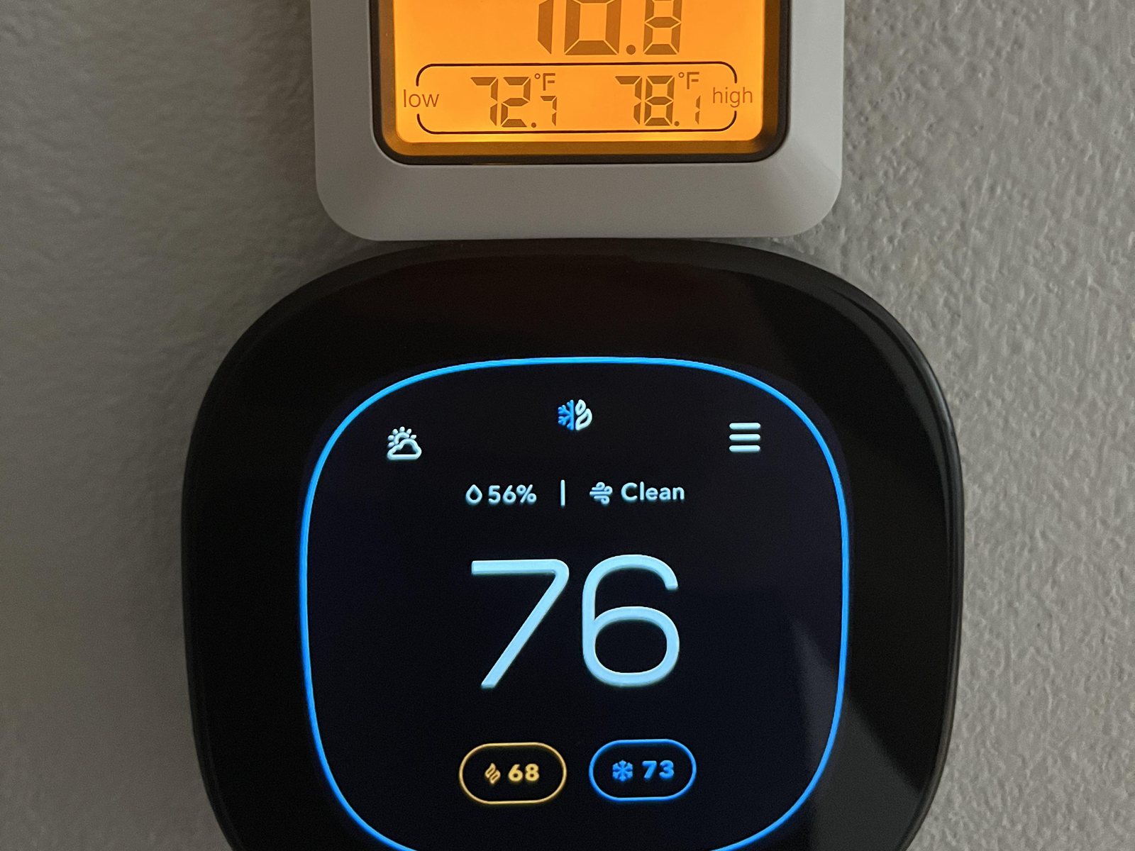 Smart thermostat on a hallway wall